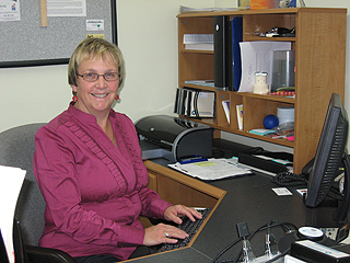 Sue at her desk.
